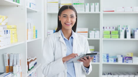 Portrait-of-pharmacist-checking-inventory