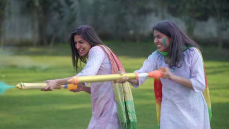 Indian-women-celebrating-Holi-outdoors