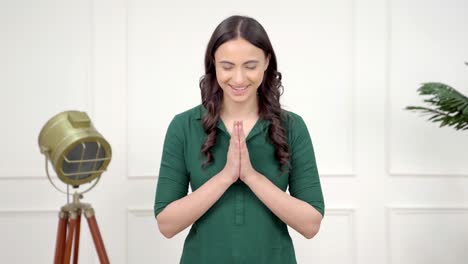 Indian-girl-saying-Namaste-and-doing-greetings