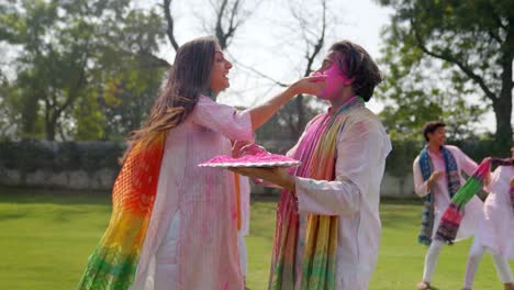 Indian-couple-enjoying-and-dancing-at-a-Holi-party