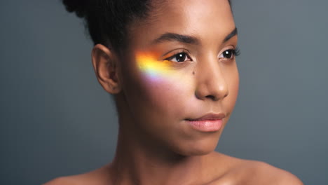 Rainbow,-prism-and-light-on-face-of-black-woman