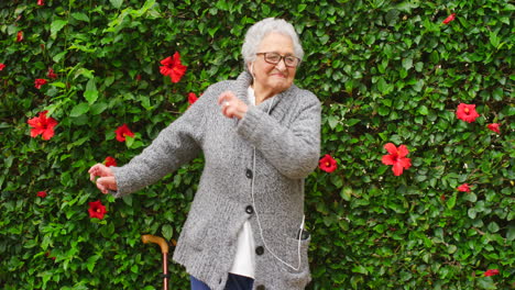 Dancing,-music-and-elderly-woman-in-a-garden