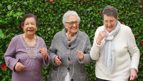 Earphones,-elderly-and-funny-friends-dance-to