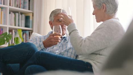 Senior-couple,-wine-and-bonding-while-sitting
