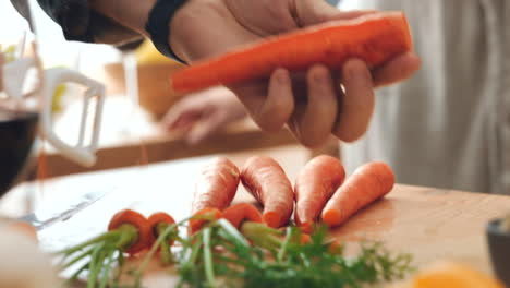Hands,-health-or-person-in-kitchen-with-carrot