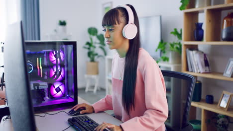 Female-gamer-streaming-and-gaming-on-her-computer