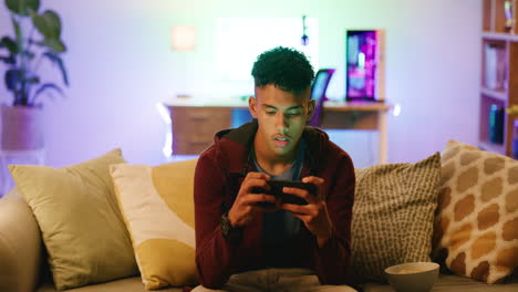 Young-man-angry-at-a-video-game-on-a-phone