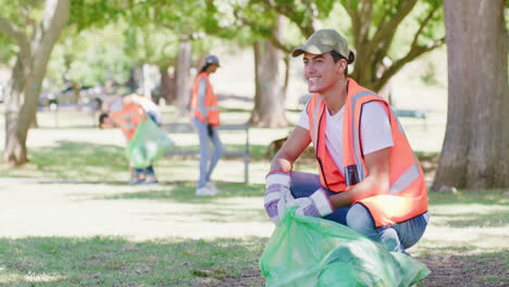 Happy-young-man-cleaning-a-park-in-an-eco-friendly