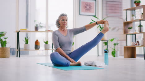 Senior-woman-doing-yoga-on-a-mat-in-her-living