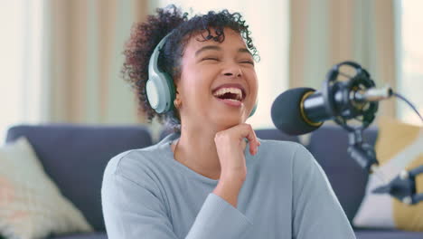 Cheerful-woman-recording-a-podcast-while-wearing