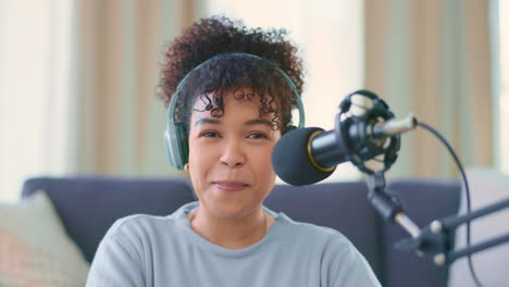 Woman-recording-a-podcast-while-wearing-headphones