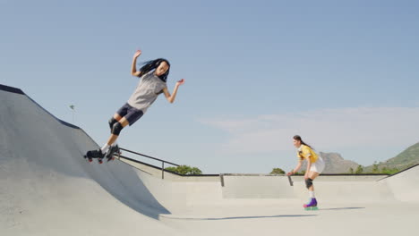 Full-length-of-two-friends-rollerskating-in-skate