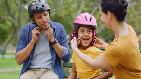 A-happy-diverse-family-fitting-a-pink-helmet