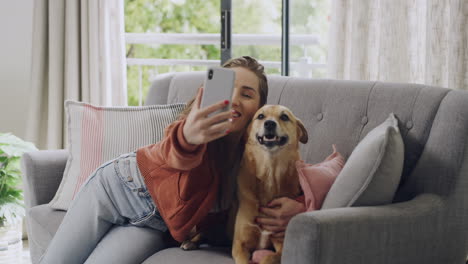 Happy-young-woman-taking-a-selfie-with-her-dog