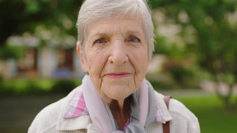 Senior-woman-portrait-in-a-park-for-retirement