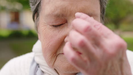 Senior-woman,-face-or-stress-headache-in-nature