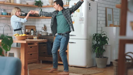 Dance,-energy-and-couple-dancing-in-the-kitchen
