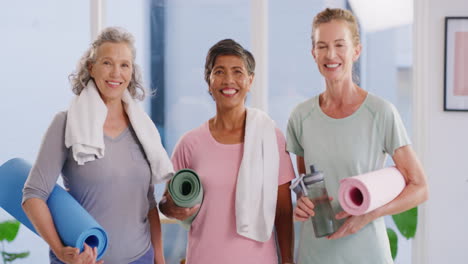 Group-of-senior-yoga-woman-holding-exercise-mats
