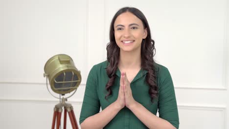 Indian-woman-saying-Namaste-and-greetings