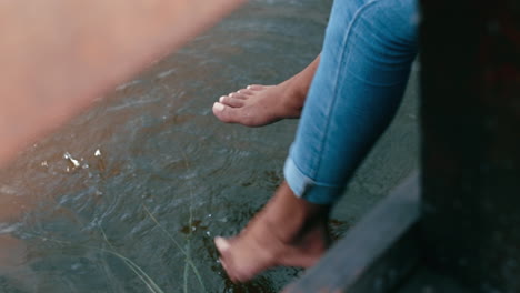 Closeup-of-a-barefoot-person-dipping-their-feet