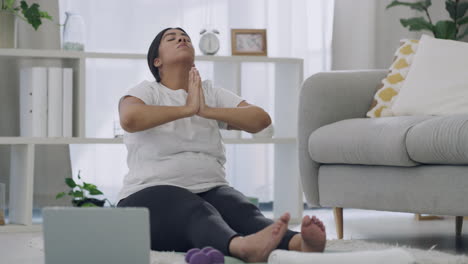 Relaxed-woman-doing-digital-yoga-class