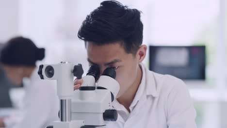 A-male-scientist-in-a-research-lab-using