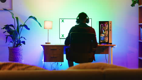 A-back-shot-view-of-a-young-gamer-playing-games