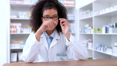 Portrait-of-a-young-pharmacist-removing-glasses