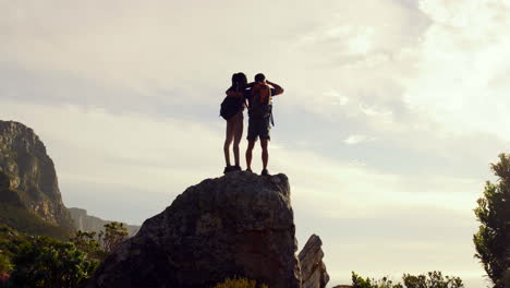 Athletic-couple-hiking,-enjoying-view