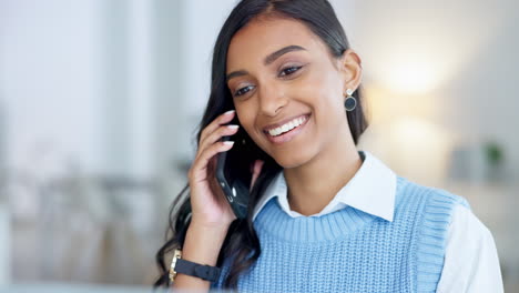 Young-business-woman-talking-on-a-phone-call