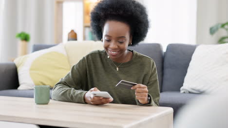 Young-black-woman-shopping-online-using-her-phone
