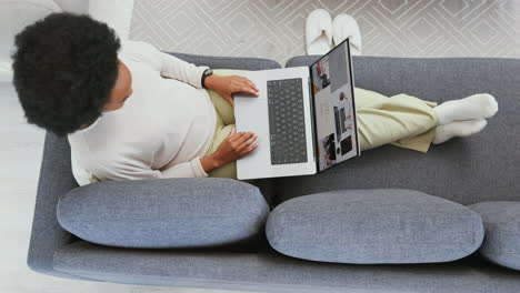Online-shopping-on-laptop-in-home-living-room