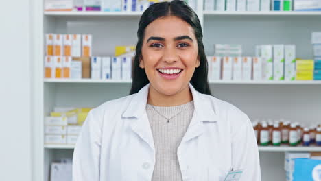 A-smiling-doctor-working-behind-the-pharmacy