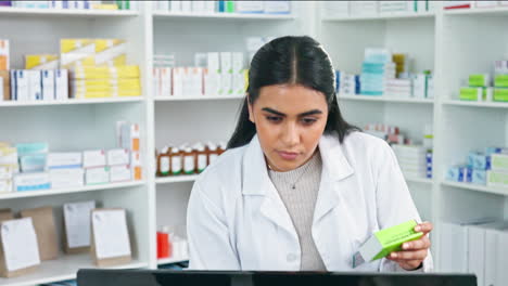 Focused-pharmacist-typing-customer-prescription