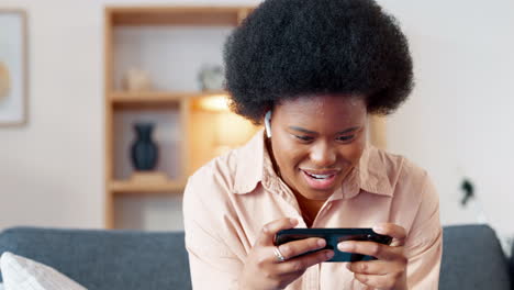 Woman-playing-a-mobile-game-on-her-phone