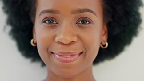 A-young-black-woman-smiling-showing-her-white