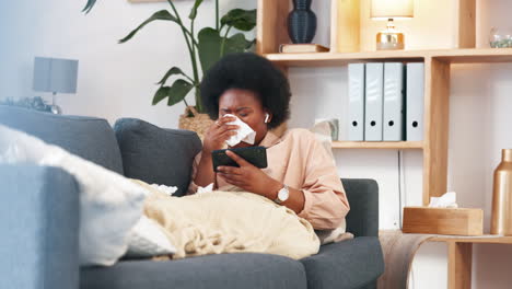 Sick-afro-woman-watching-phone-while-coughing