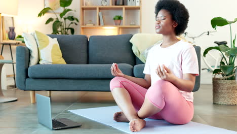 Young-black-woman-meditating-on-a-webinar