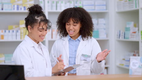 Two-female-pharmacists-use-a-checklist