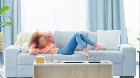 Woman-jumping-to-lie-down-on-a-couch