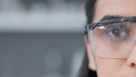 Half-face-of-a-female-biologist-in-safety-glasses