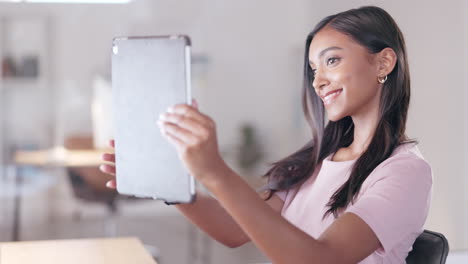 Young-happy-woman-taking-a-selfie-with-a-digital