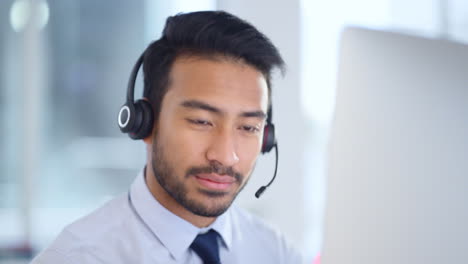 Call-centre-agent-wearing-headset-giving-great