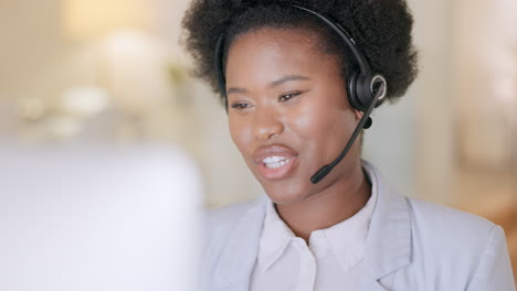 Happy-black-call-center-agent-wearing-a-headset