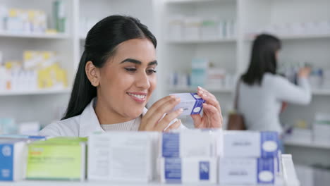 Smiling-female-pharmacy-student-working-with-store