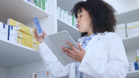 Pharmacist-typing-online-inventory-on-a-digital