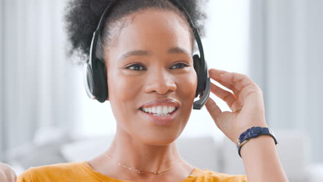 Happy-female-call-center-agent-talking-on-headset