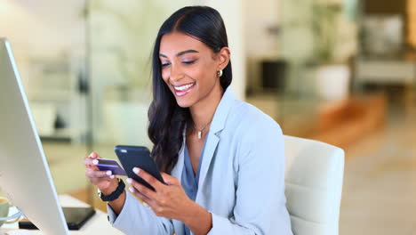 Happy-woman-making-online-payment-with-phone