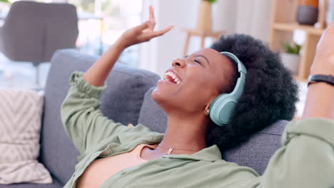 Happy,-carefree-and-relaxed-woman-listening-to