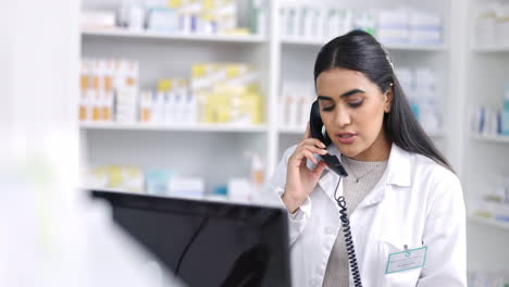 Pharmacist-talking-on-telephone